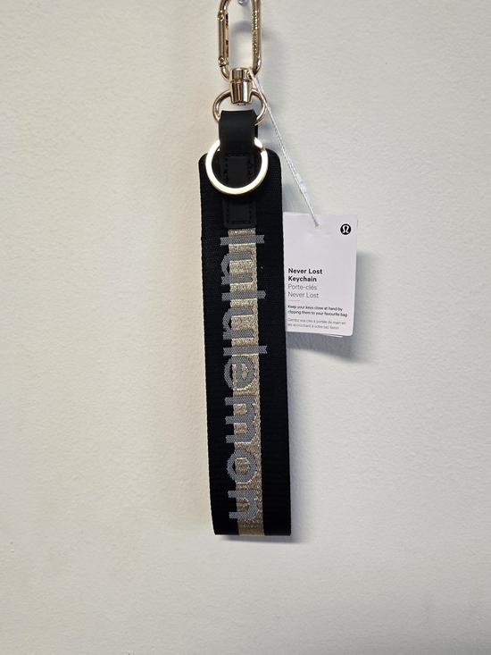 lululemon athletica Accessories - lululemon athletica Black Wristlet Keychain with Gold Logo Stripe